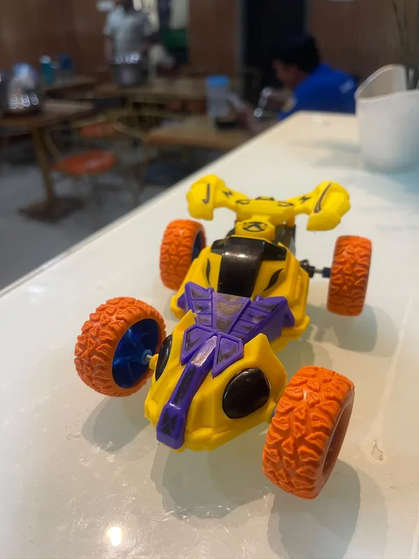Yellow_And_Purple_Four_Wheel_Toy_Buggy