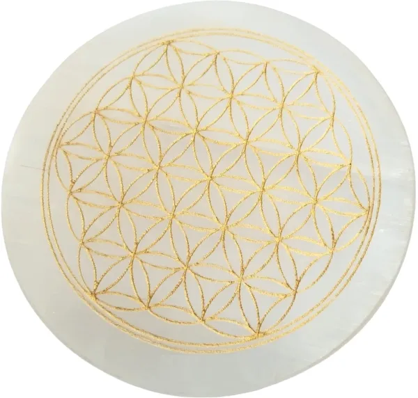 Natural_selenite_crystal_charging_plate_engraved_with_a_sacred_Om_and_floral_mandala_symbol,_commonly_used_for_meditation,_reiki,_and_cleansing_other_crystals._(3_inch)