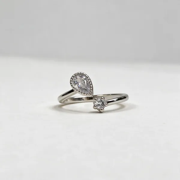 Silver-Tone_Open_Ring_With_Pear-Shaped_Stone_And_Floral_Detail