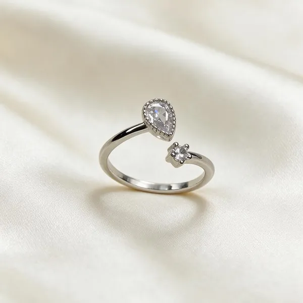 Silver-Tone_Open_Ring_With_Pear-Shaped_Stone_And_Floral_Detail