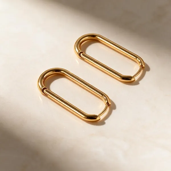Flagged:_Description_References_Metallic_Oval_Clips/Clasps,_Not_Earrings._Human_Review_Needed.