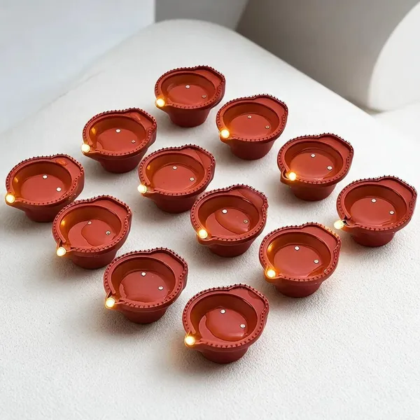 Premium_Diwali_Festive_Combo_–_Borosilicate_Glass_Oil_Lamp_&_Water_Sensor_LED_Diyas_with_Free_Lotus_Seeds_for_Pooja