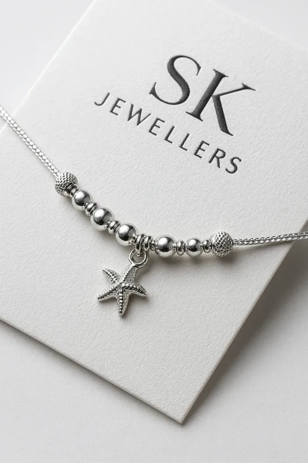 Garden_Halo_Sterling_Silver_Anklet_With_Ruby_And_Emerald_Talisman_Charm_Pair