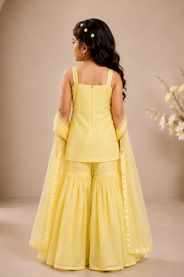 A_Delicate_Yellow_Suit_With_Delicate_Floral_Embroidery_And_Paired_With_Gharara_Butter_Yellow