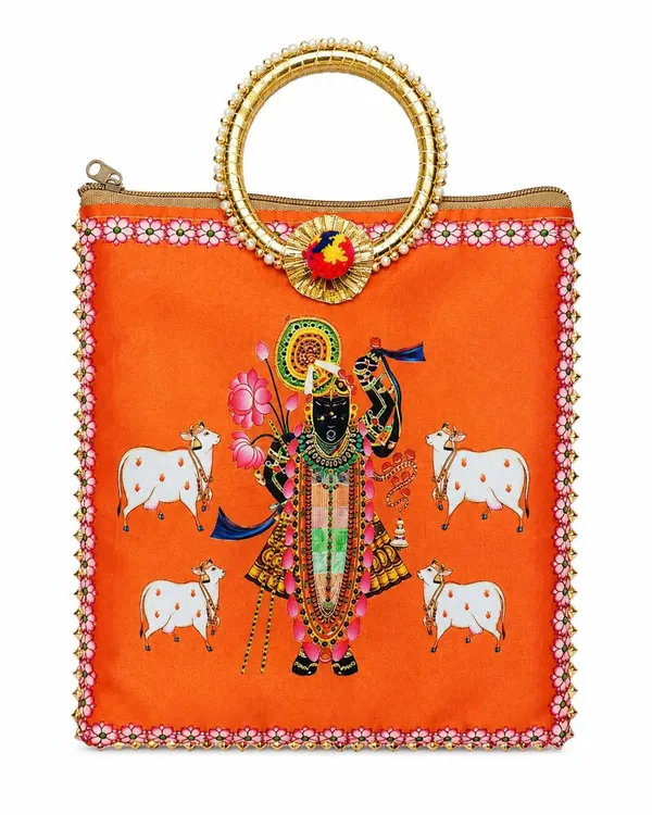 Orange_Satin_Pichwai_Shrinathji_Print_Festive_Handbag_For_Women