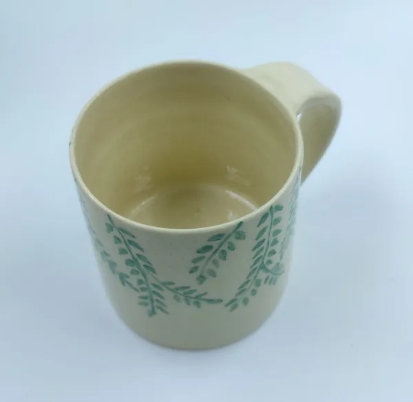 Studio_Pottery_Stoneware_Coffee_Mug_–_Hand-Painted_Leaf_Motif_|_Nature-Inspired_Ceramic_Drinkware