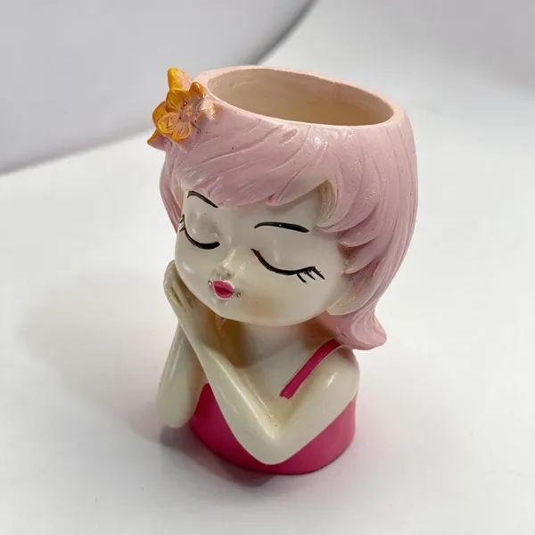 Pink_Resin_Seated_Girl_With_Flower_Accent_Figurine