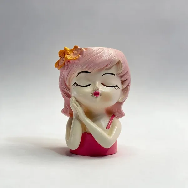 Pink_Resin_Seated_Girl_With_Flower_Accent_Figurine