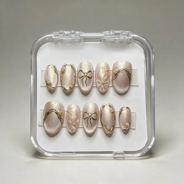 Saheli_Pearl_Pink_Bow_Gold_Detail_Oval_Press-On_Nail_Set_Of_10