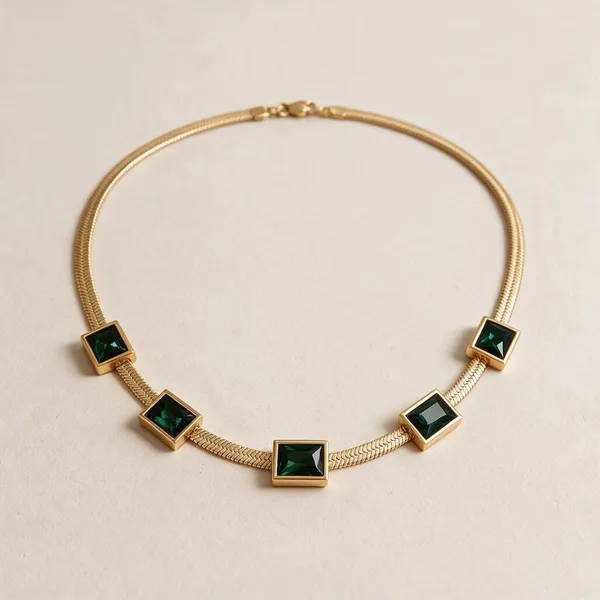 Statement_Necklace_Featuring_Five_Bezel_Set,_Baguette_Cut_Emerald_Green_Cubic_Zirconia_Stones_Along_With_Liquid_Smooth_Flat_Herringbone_Snake_Chain_(Gold)