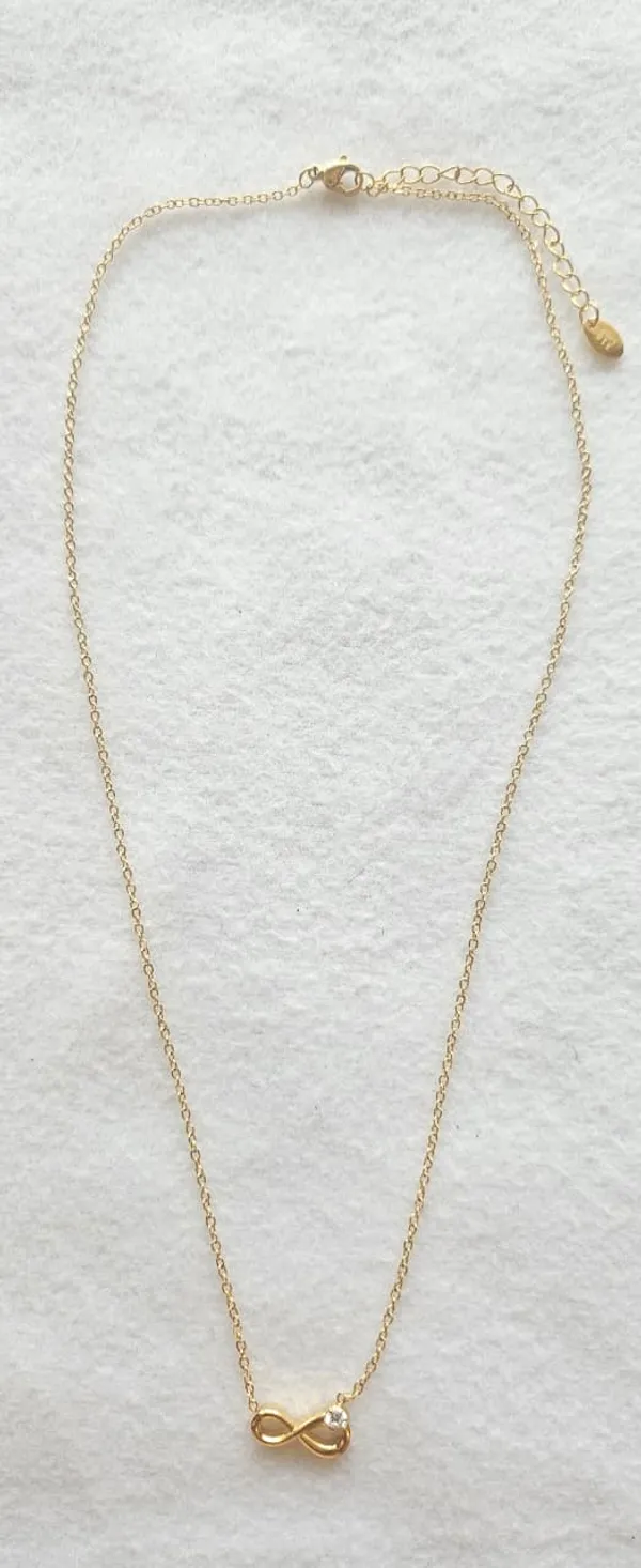 Gold_Steel_Infinity_Symbol_Solitaire_Pendant_Necklace_For_Women