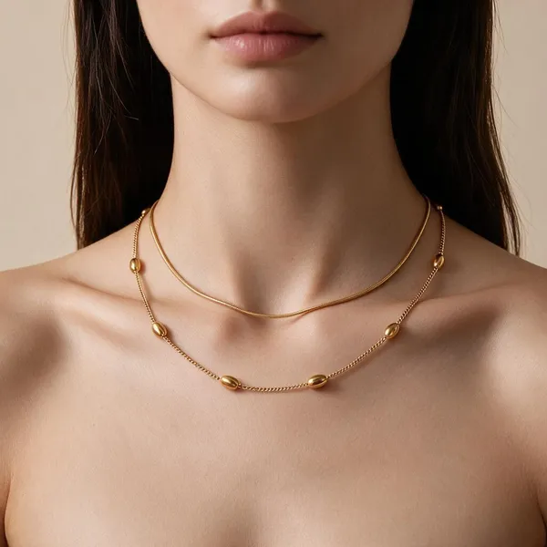 Handmade_Necklace_With_Double_Layer_Graceful_Chains_Having_Delicate_Gold_Tone_Bead_Accents_And_A_Sleek_Curved_Silhouette_(Gold)