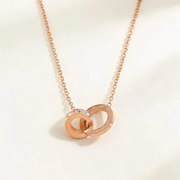 Interlocking_Double_Ring_Necklace_With_Etched_Roman_Numerals_And_Shimmering_Pave_Set_Micro_Crystals_(Rose_Gold)