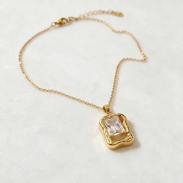 Open_Work_Gold_Frame_Holding_A_Large_Central_Square_Cut_Clear_Rhinestone_Pendant_Necklace_(Gold)