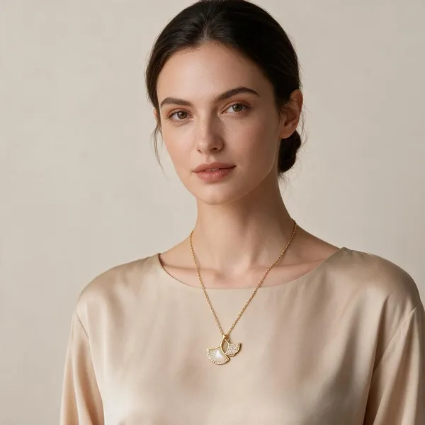 Dual_Ginkgo_Leaf_Pendant_Necklace_With_Smooth_Mother_Of_Pearl_Style_Stone_And_Small_Overlapping_Sparkling_Pave_Set_Rhinetsones_Leaf_(Gold)