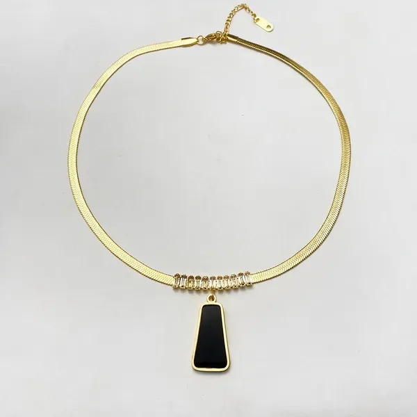 Modern_Necklace_Featuring_Sleek_Herringbone_Chain_Paired_With_Bold_Black_Mother_Of_Pearl_Inlay_Trapezoid_Pendant_Suspended_From_A_Horizontal_Slider_Tube_Accent_Encrusted_With_Sparkling_Pave_Set_Stones_(Gold)
