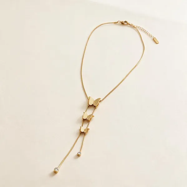 Lariat_Style_Necklace_Featuring_Three_Polished_Silver_Toned_Butterfly_Motifs_Stacked_Sequentially_Along_A_Dual_Strand_Snake_Chain_Drop_(Gold)