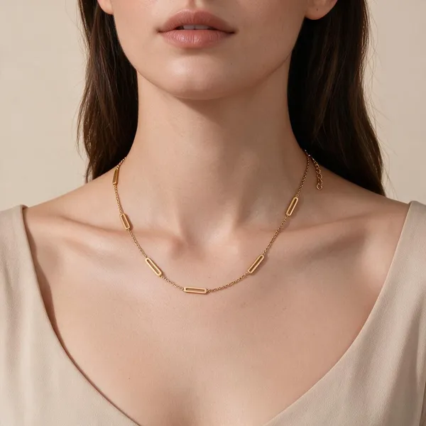 Refined_Twist_On_Classic_Link_Style_Featuring_Slender_Elongated_Rectangular_Paperclip_Inspired_Station_Bars_Interspersed_Along_A_Delicate_Chain_(Gold)