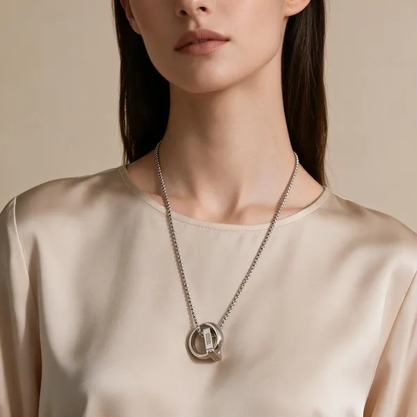 Double_Interlocking_Ring_Pendant_Necklace_Boasting_Smooth,_Polished_Circular_And_Square_Bands_With_Zircon_Inlay_(Silver)