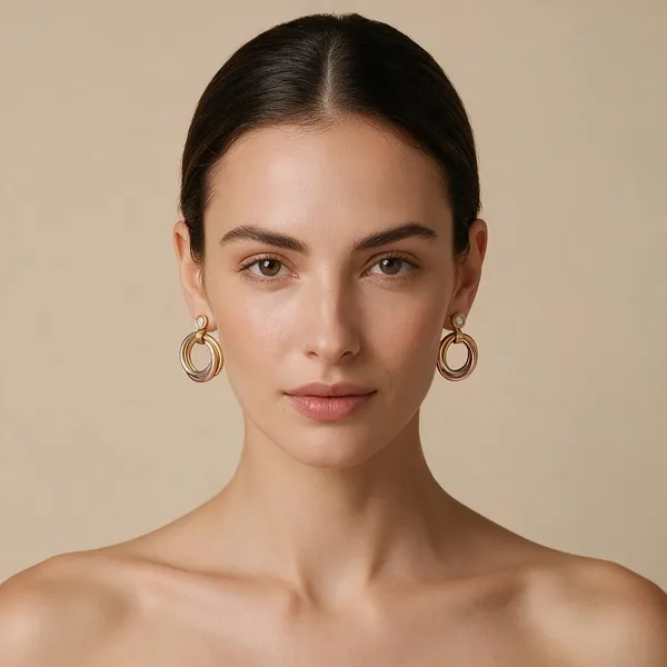 Geometric_Interlocking_Drop_Earings_With_Tri_Color_Bands_In_Polished_Gold,_Rose_Gold_And_Silver_Finishes_Suspended_From_A_Brilliant_Bezel_Set_Zircon_Accent