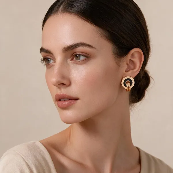 Modern_Stud_Earrings_Featuring_A_Circular_Disc_Design_With_Engrave_Style_Roman_Numerals_And_A_Contrasting_Black_Acrylic_Inlay_(Rose_Gold)