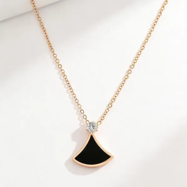 Fan_Shaped_Sector_Pendant_Necklace_With_A_Contrasting_Black_Acrylic_Inlay_And_A_Sparkling_Zircon_Stone_Crowns_The_Geometric_Motif_Suspended_Seamlessly_From_A_Delicate_Matching_Rose_Gold_Cable_Chain_(Rose_Gold)
