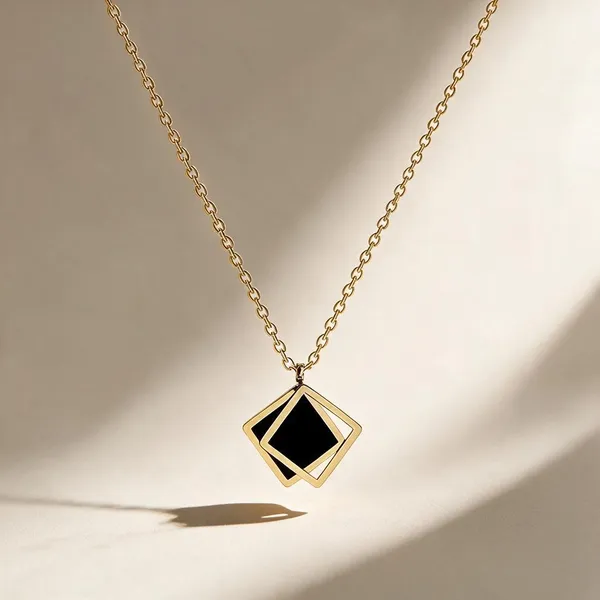 Striking_Modern_Necklace_Featuring_A_Openwork_Diamond_Shaped_Pendant_Frame_With_An_Embedded_Geometric_Black_Enamel_Inlay_(Gold)