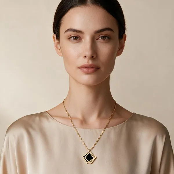 Striking_Modern_Necklace_Featuring_A_Openwork_Diamond_Shaped_Pendant_Frame_With_An_Embedded_Geometric_Black_Enamel_Inlay_(Gold)