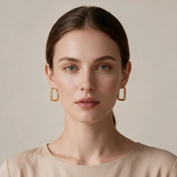 Sleek_Elongated_Rectangular_Modern_Huggie_Hoop_Earrings_Designed_With_A_Secure_Click_Top_Clasp_(Gold)