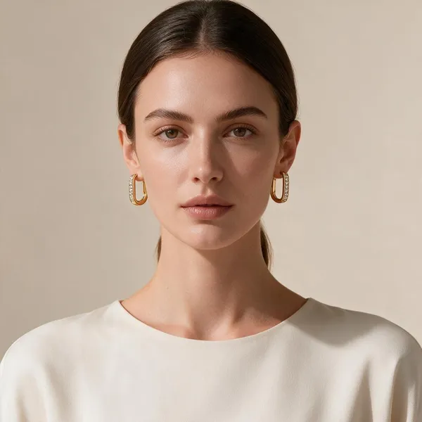 Sleek_Elongated_Rectangular_Modern_Huggie_Hoop_Earrings_Designed_With_A_Secure_Click_Top_Clasp,_Front_Edge_Is_Set_With_Achannel_Of_Sparkling_Clear_Rhinestones_(Gold)