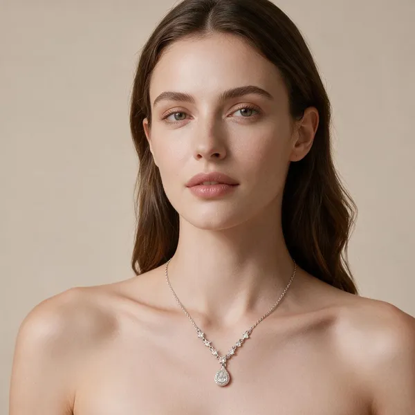 Sparkling_Pear_Cut_Cubic_Zirconia_Stone_Pendant_Necklace_Embellished_With_Graduating_Halo_Set_Zirconia_Stations_Leading_To_The_Main_Drop_Central_Teardrop_(Silver)