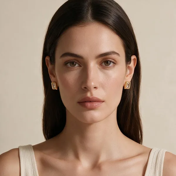 Modern_Clean_Geometric_Frame_Stud_Earrings_Combined_With_Step_Cut_Faceting_Featuring_A_Bezel_Set,_Emerald_Cut_5A_Clear_Zircon_Gemstone_(Gold)