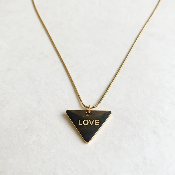 Sleek_Necklace_Featuring_A_Contemporary_Inverted_Triangle_Pendant_Finely_Engraved_With_The_Word_Love_(Gold)