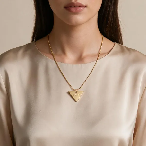Sleek_Necklace_Featuring_A_Contemporary_Inverted_Triangle_Pendant_Finely_Engraved_With_The_Word_Love_(Gold)