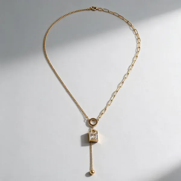 Asymmetric_Dual_Chain_Designer_Lariat_Necklace_Featuring_A_Black_Enamel_O_Ring_Centerpiece,_The_Y_Drop_Silhouette_Featuring_A_Sparkling_Emerald_Cut_5A_Cubic_Zirconia_Pendant_Layered_With_A_Gold_Initial_Letter_"D"_Charm,_Finishing_With_A_Dangling_Gold_Bead_Tassel_Drop_(Gold)