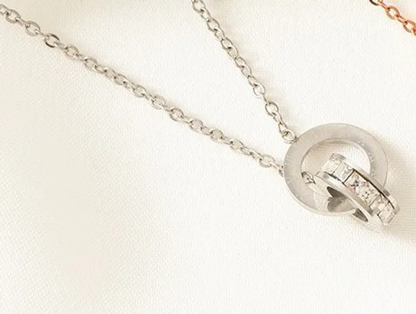 Silver_Steel_Interlocking_Ring_Zirconia_Pendant_Necklace_For_Women