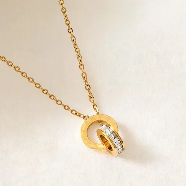 Gold_Steel_Interlocking_Ring_Zirconia_Pendant_Necklace_For_Women