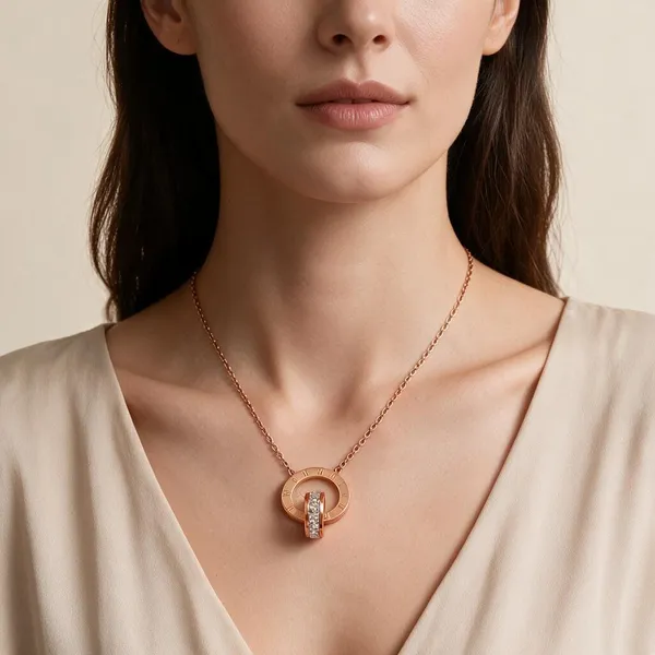 Two_Interlocking_Ring_Pendants_Necklace_With_One_Plain_Polished_Circle_Paired_With_A_Secondary_Ring_Inlaid_With_Sparkling_Micro_Pave_Cubic_Zirconia_(Rose_Gold)