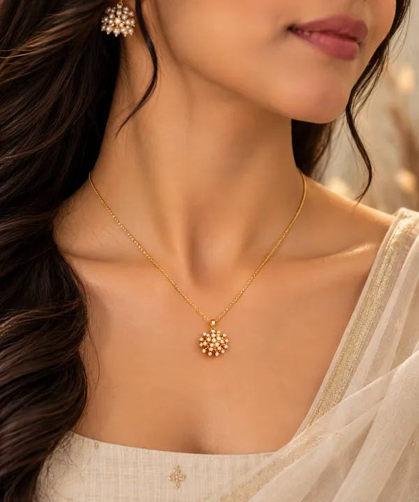 Radiant_Floral_Sunburst_Pendant_Necklace,_crafted_in_316_stainless_steel_with_18K_gold_plating_and_sparkling_crystal_details_(Gold)