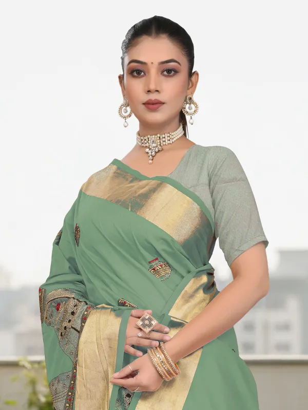Deep_Green_Matka_Silk_Portrait_Motif_Saree_For_Women