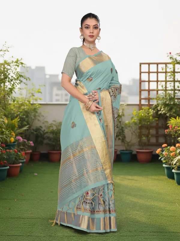 Powder_Blue_Matka_Silk_Portrait_Motif_Saree_For_Women