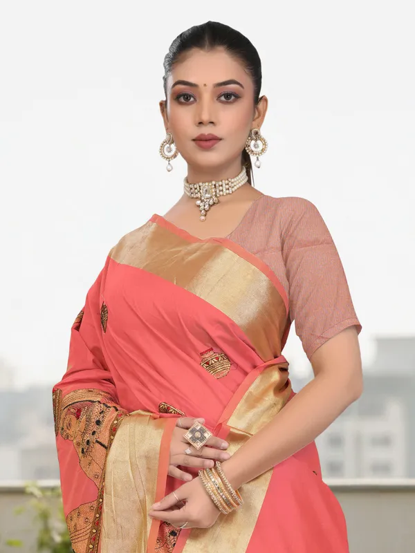 Coral_Pink_Matka_Silk_Portrait_Motif_Saree_For_Women