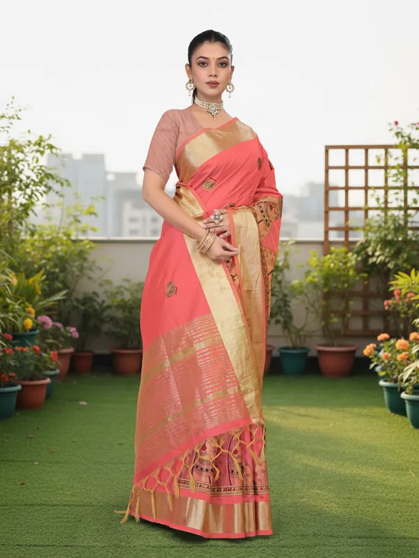 Coral_Pink_Matka_Silk_Portrait_Motif_Saree_For_Women