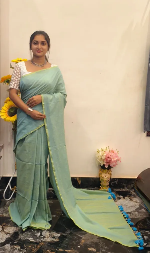 Mint_Green_Masrise_Cotton_Solid_Tassel_Border_Saree_For_Women