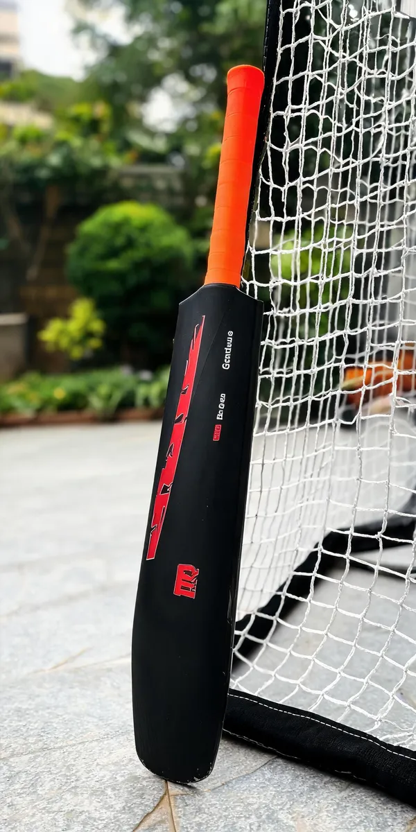 Red_Black_Plastic_Full_Size_Cricket_Bat_For_Tennis_Ball