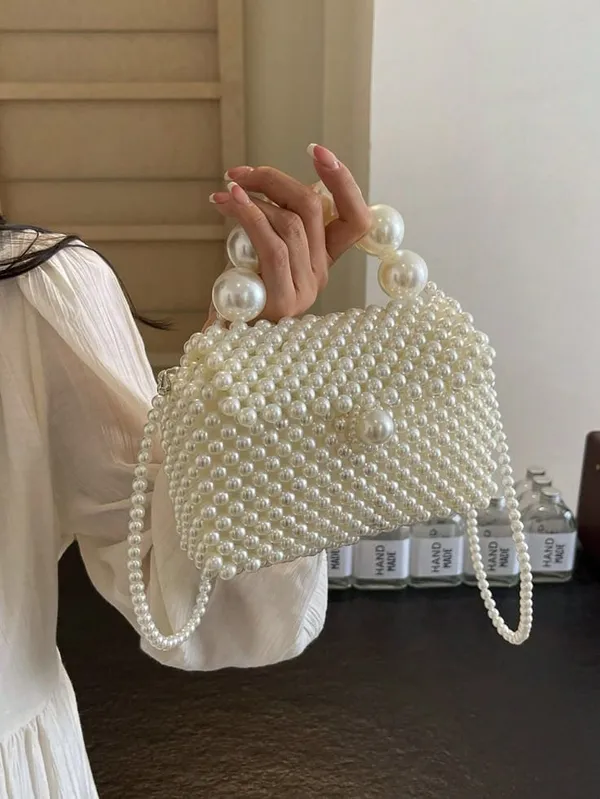 Elegant_White_Pearl_Evening_Clutch_with_Oversized_Pearl_Handle