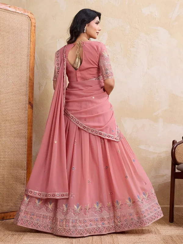 Elegant_Peach_Georgette_Embroidered_Lehenga_Choli_Set_With_Matching_Blouse_And_A_Decorative_Dupatta
