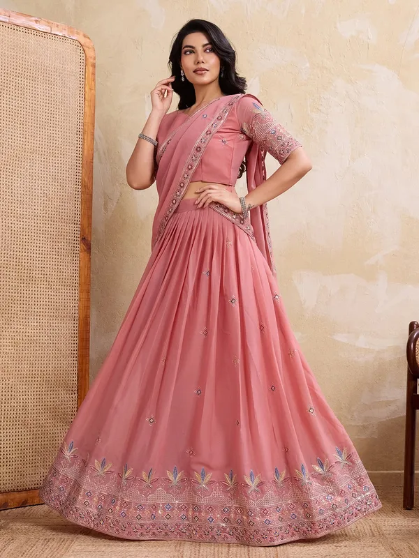 Elegant_Peach_Georgette_Embroidered_Lehenga_Choli_Set_With_Matching_Blouse_And_A_Decorative_Dupatta