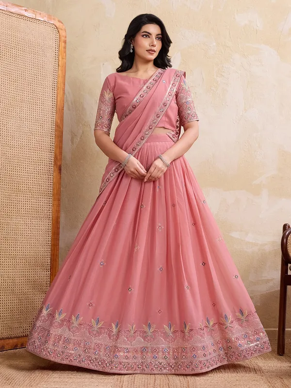 Elegant_Peach_Georgette_Embroidered_Lehenga_Choli_Set_With_Matching_Blouse_And_A_Decorative_Dupatta