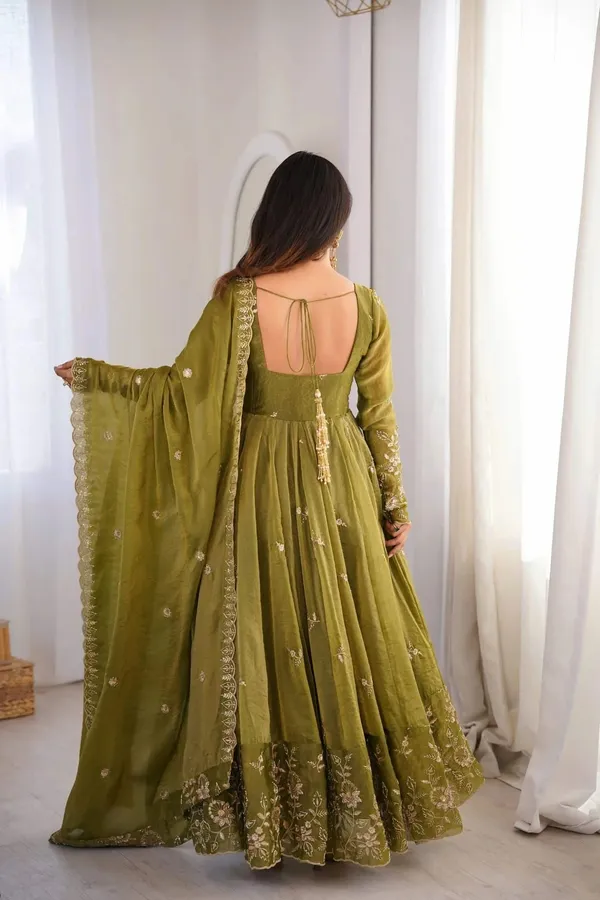 Flared_Olive_Green_Anarkali_Suit_With_Detailed_Floral_Embroidery_Along_The_Hem_And_Sleeves,_Paired_With_A_Matching_Dupatta
